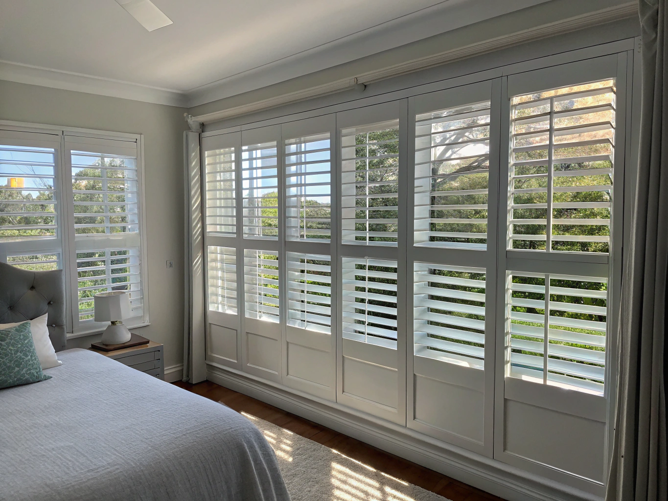 White plantation shutters in architectural residence.