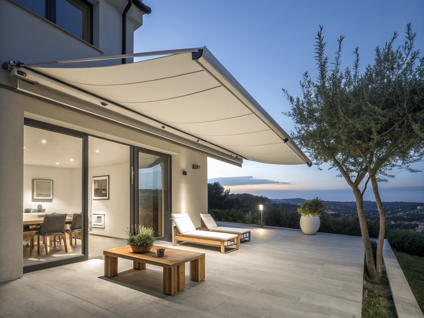 Exterior motorized shading system on a modern terrace facade.