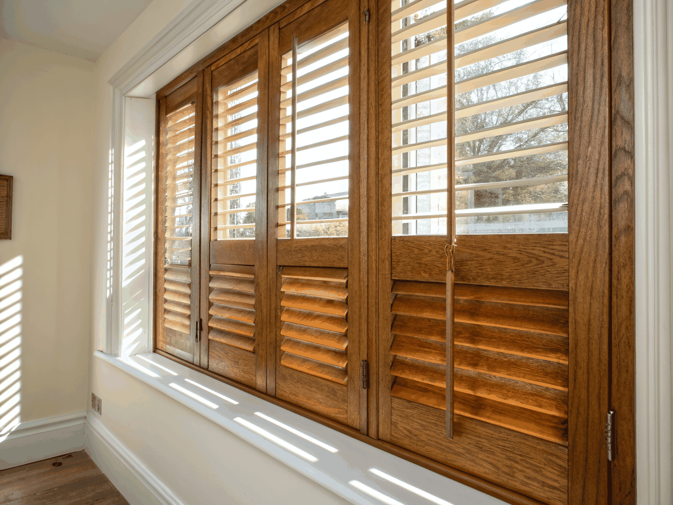 Custom plantation shutters installed in a bedroom suite.