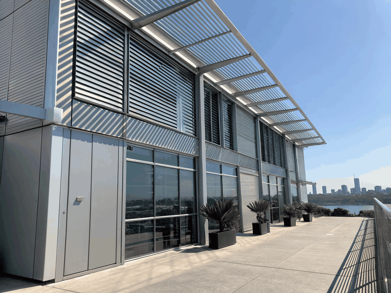 Modern exterior facade fitted with engineered drop shades